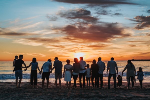 family outside on a beach 